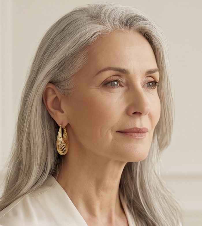Dubai Style - Mystery- .925 Sterling Silver dipped in 22K Gold handmade Earrings - Side view, woman wearing Dubai Style gold-dipped earrings.