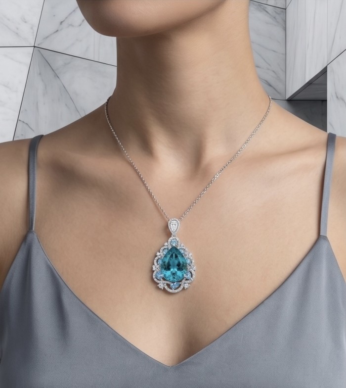 Atlantica - amazing quality pearl cut 14.5 CARAT genuine Swiss Blue Topaz rhodium over .925 Sterling Silver handmade pendant - Necklace with blue gemstone pendant, worn on chest, marble background.
