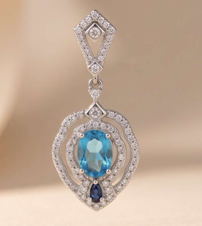 Tranquillity - 4.7 carat carved Swiss Blue Topaz .925 Sterling Silver dipped in Rhodium Handcrafted Statement earrings - Close-up of Tranquillity pendant with blue topaz and diamond accents.
