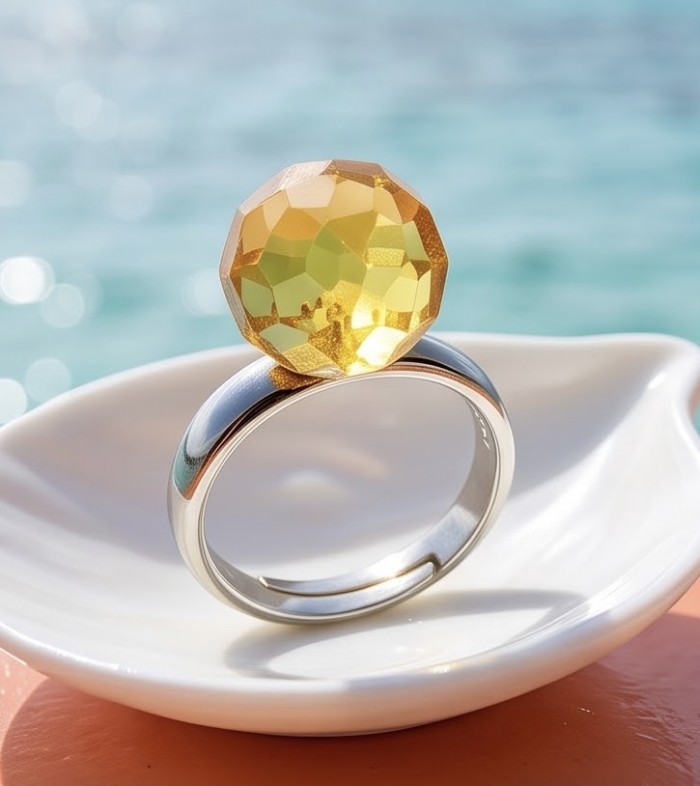 Modern Concept Golden Sphere - Natural faceted Baltic Amber 18K Gold over .925 Sterling Silver ring s. 8 - Golden faceted amber ring close-up on a dish with ocean background.
