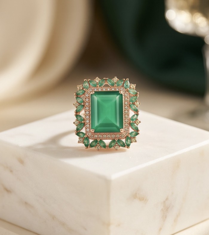Elizabeth baquette cut 24.8 carat Colombian Emerald 22K Rose Gold over .925 Sterling Silver handcrafted Ring size 7 1/2 - Close-up of Elizabeth baguette cut Colombian emerald ring on display.