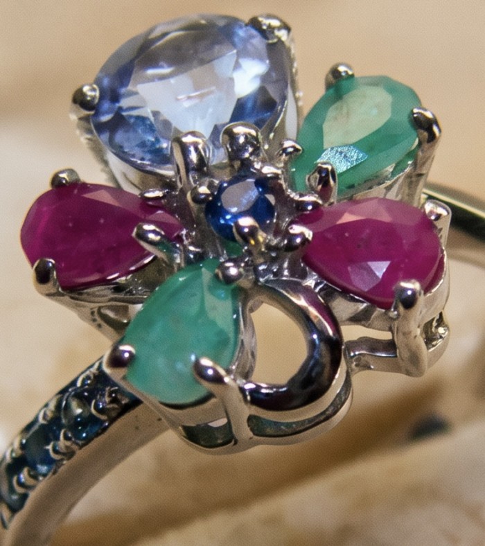 Luxurious 6.5 ctw Tanzanite .925 Sterling Silver handcrafted Statement Ring size 9 - Close-up of a luxurious Tanzanite ring with colorful gemstones.