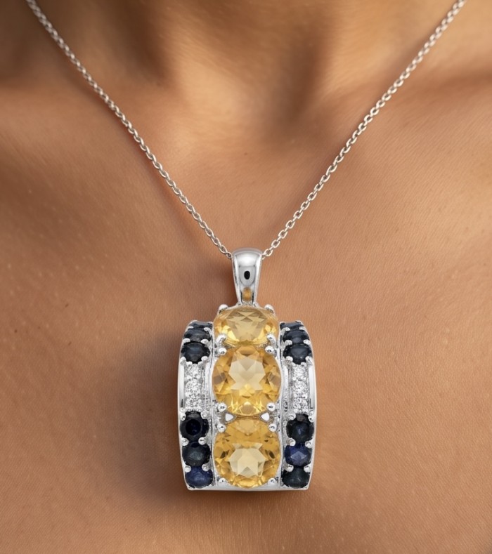 Victoria Authentic 12.4 carat Brazilian Citrine .925 Sterling Silver dipped in rhodium brilliantly handcrafted Statement Pendant - Citrine pendant with blue stones, close-up view, worn on neck.