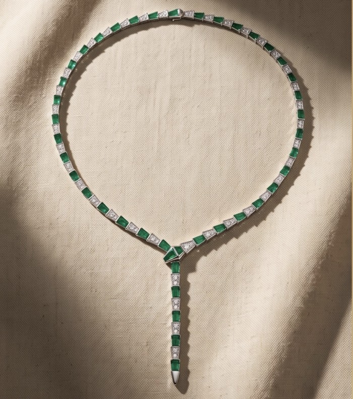 Snake - Iconic design - genuine INLAY MALACHITE .925 Sterling Silver dipped in Rhodium handcrafted Necklace - Necklace with malachite and silver, top view on fabric background.