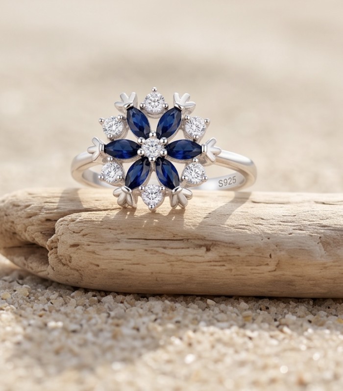 Real 3.2 carat Sapphire Italy Made Silver Sterling Silver spinning ring s. 8 1/4 - Front view of sapphire and diamond floral ring on driftwood.
