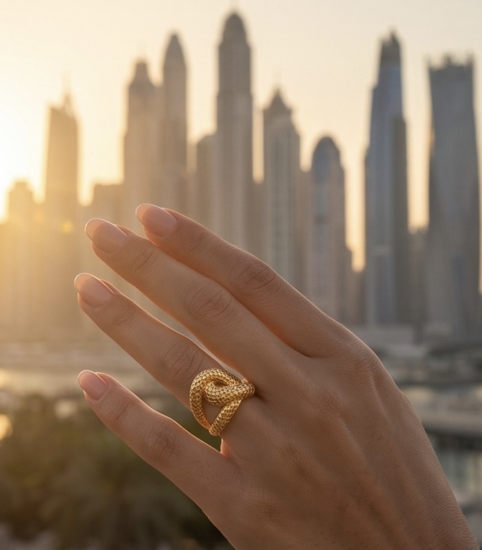 Dubai Style - Golden knot - .925 Sterling Silver dipped in 22K Gold handmade Large ring size 8 - Golden knot ring on hand with city skyline in the background.