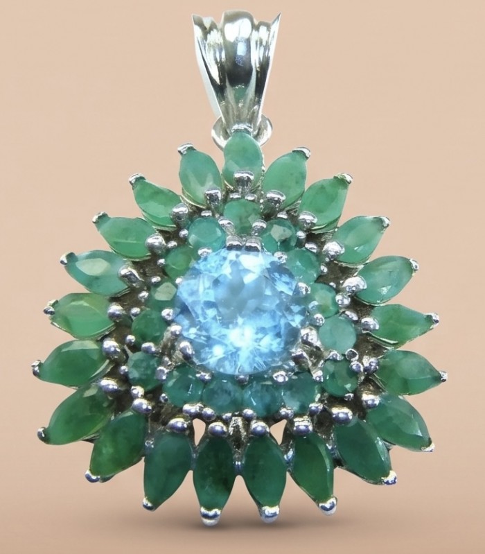 Oceania 12.8 carat Swiss Blue Topaz 18K Gold over .925 Sterling Silver Handcrafted Pendant Brooch - Close-up of Oceania pendant with blue topaz and green stones.