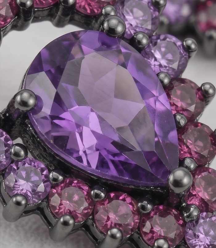 Natural 10.6 carat fancy pear cut Amethyst black rhodium over .925 Sterling Silver handmade earrings - Close-up of pear cut amethyst and surrounding stones in black rhodium setting.