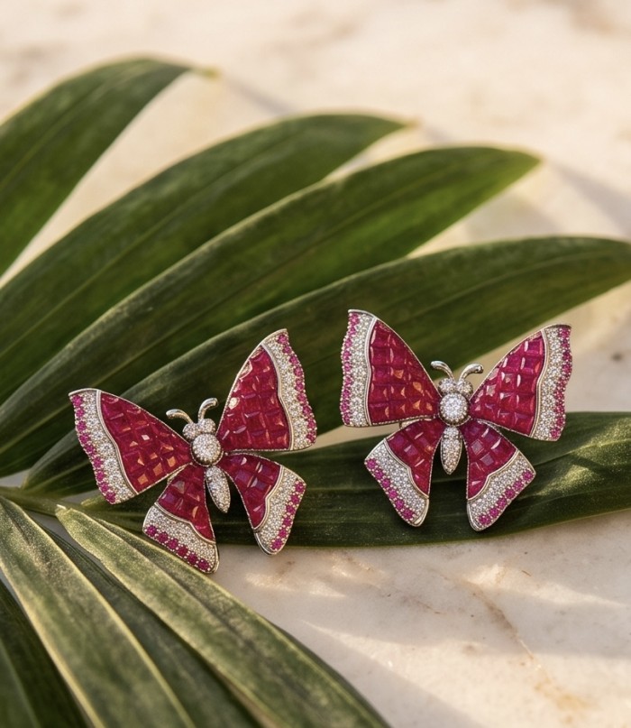 Natural 18.2 carat mystery setting Ruby Butterflies .925 Sterling Silver handcrafted earrings - Butterfly earrings on leaf, showing ruby detail and sparkling accents.