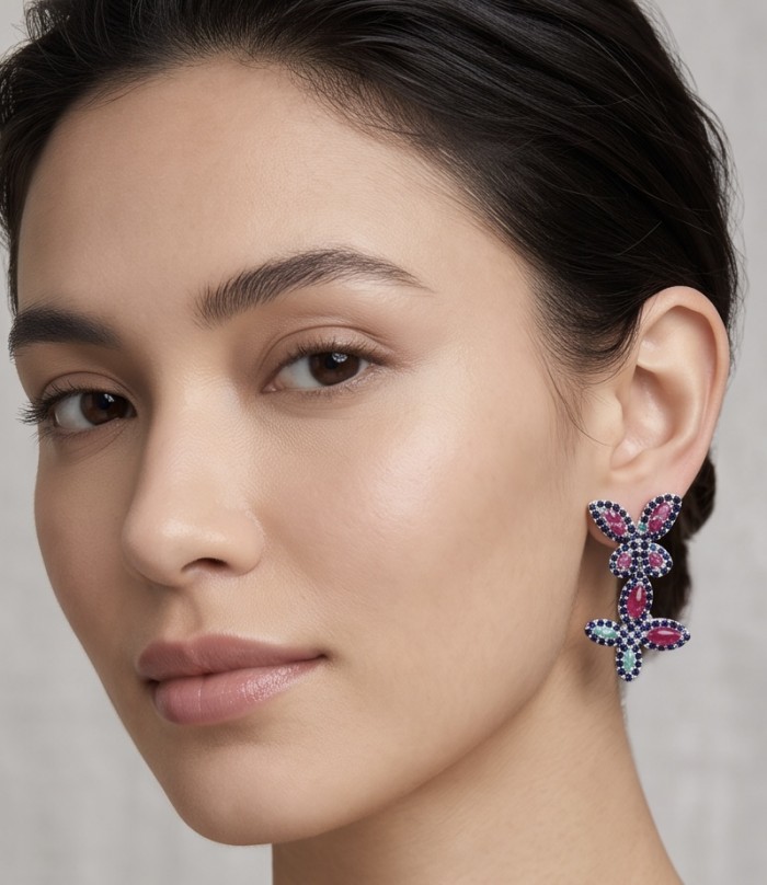 RARE BEAUTY! Valentina 28.2 carat Ruby Emerald Sapphire .925 Sterling Silver dipped in rhodium Statement handcrafted earrings - Woman wearing Valentina earrings; close-up side view.