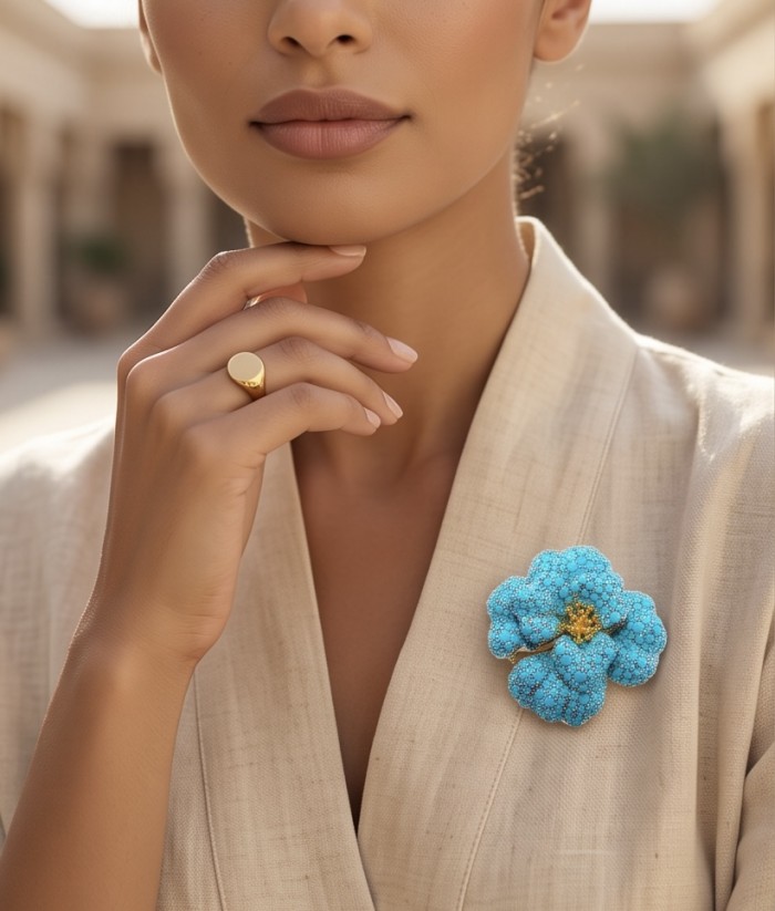 Retro Style - Precious Rose Genuine 24.2 carat pave Turquoise rhodium over .925 Sterling Silver handmade Pendant - Brooch - Model wearing brooch and gold ring, brooch close-up displayed.