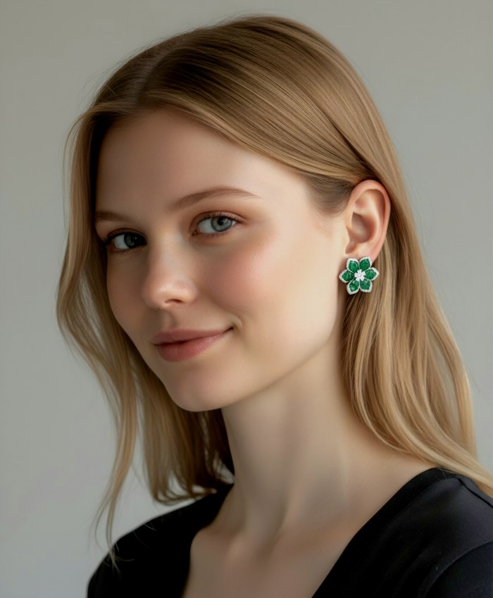 Born to Glam authentic 18.7 carat mystery setting Colombian Emerald .925 Sterling Silver handcrafted Statement earrings - Woman wearing green, flower-shaped gemstone earrings, side view.