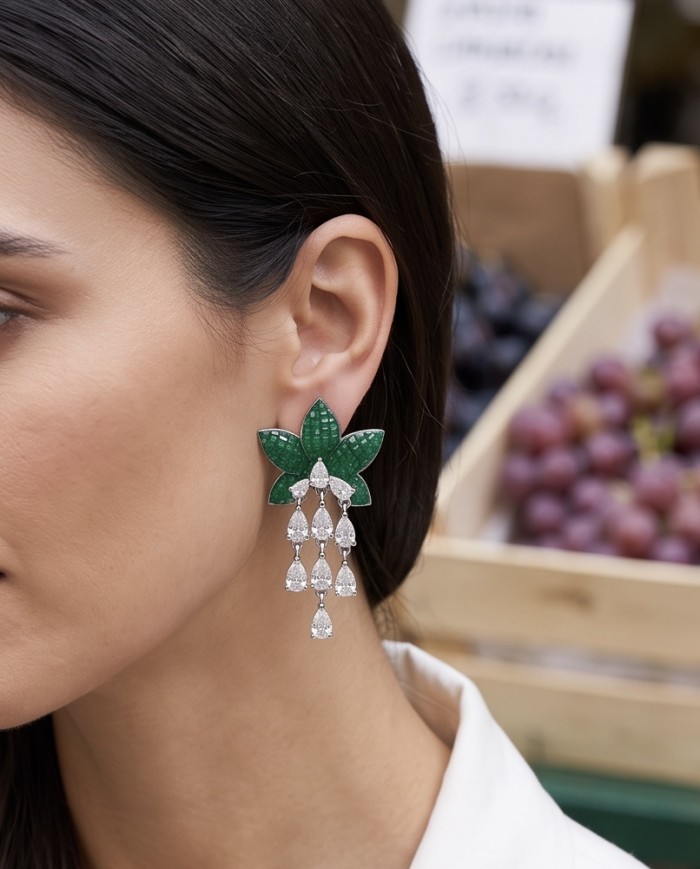 Born to Glam authentic 10.7 carat mystery setting Colombian Emerald .925 Sterling Silver handcrafted Statement earrings - Woman wearing green leaf drop earrings, side view close-up.