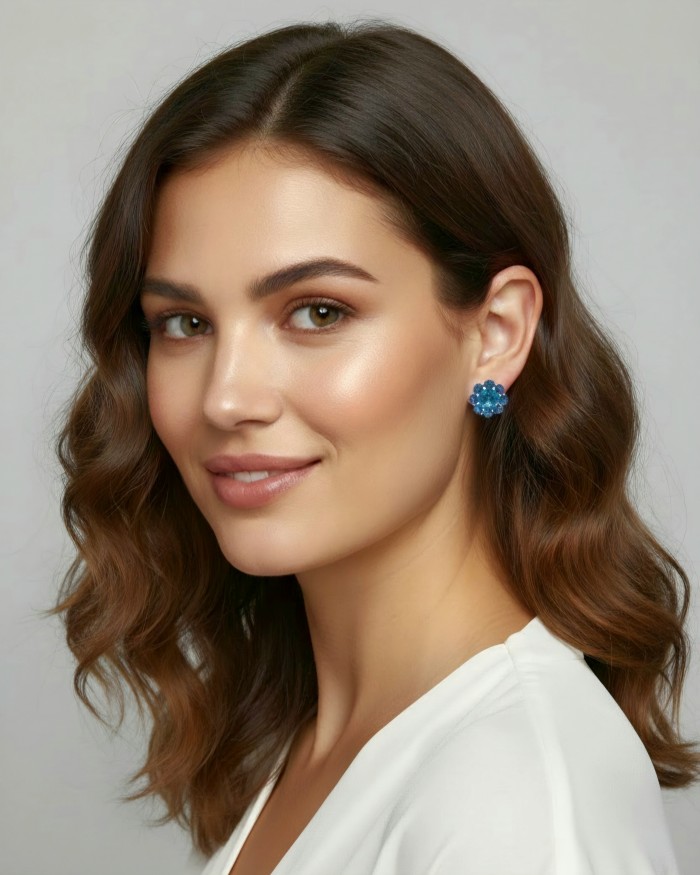 Forget-me-not 9.5 carat London Blue Topaz rhodium over .925 Sterling Silver handmade earrings - Woman wearing 9.5 carat London Blue Topaz earrings, side view.
