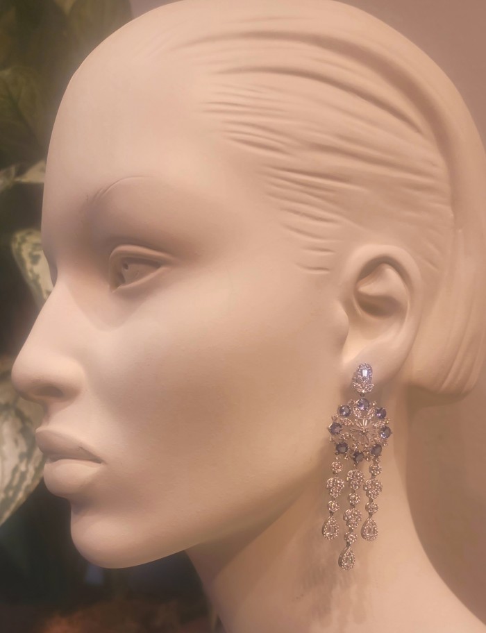 Elizabeth Natural luxurious Floral design 28.5 carat Tanzanite .925 Silver handcrafted earrings - Side view of floral 28.5 carat Tanzani earrings on mannequin.