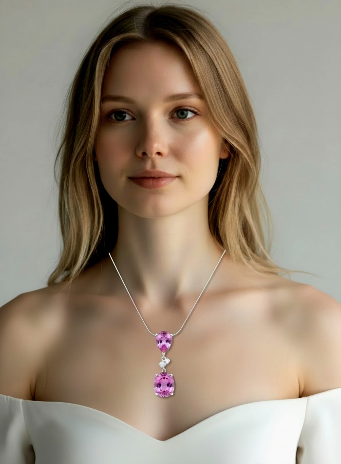 Incredible oval cut 18.8 carat Bubblegum Pink Sapphire .925 Sterling Silver handcrafted pendant - Woman wearing pink sapphire necklace, front view.