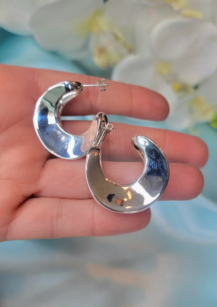 LARGE - EXTRAVAGANZA - Highly Polished Fancy .925 Sterling Silver Italy made Earrings - Close-up of polished crescent-shaped silver earrings in hand.